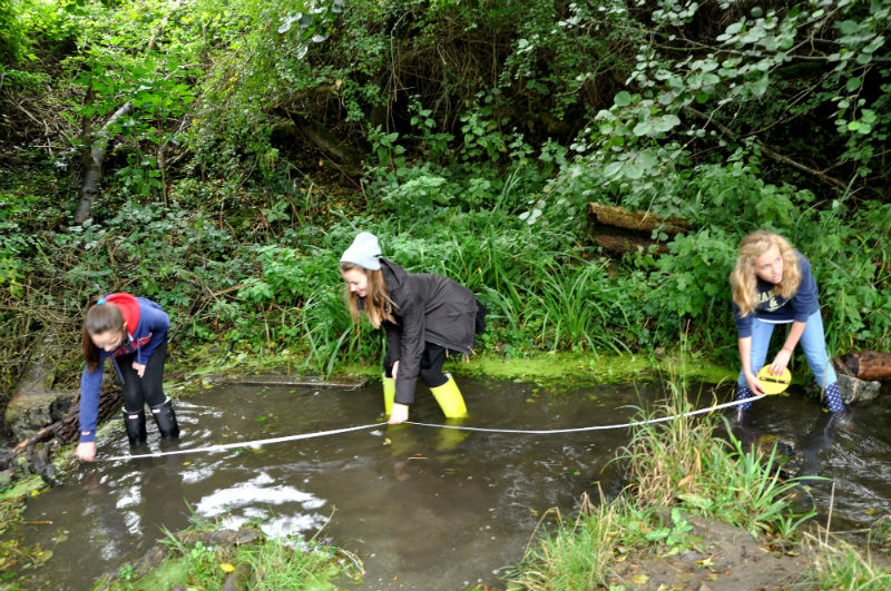 Secondary-girls-measuring-river-flow