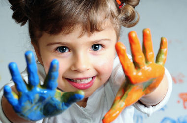 child with painted hands